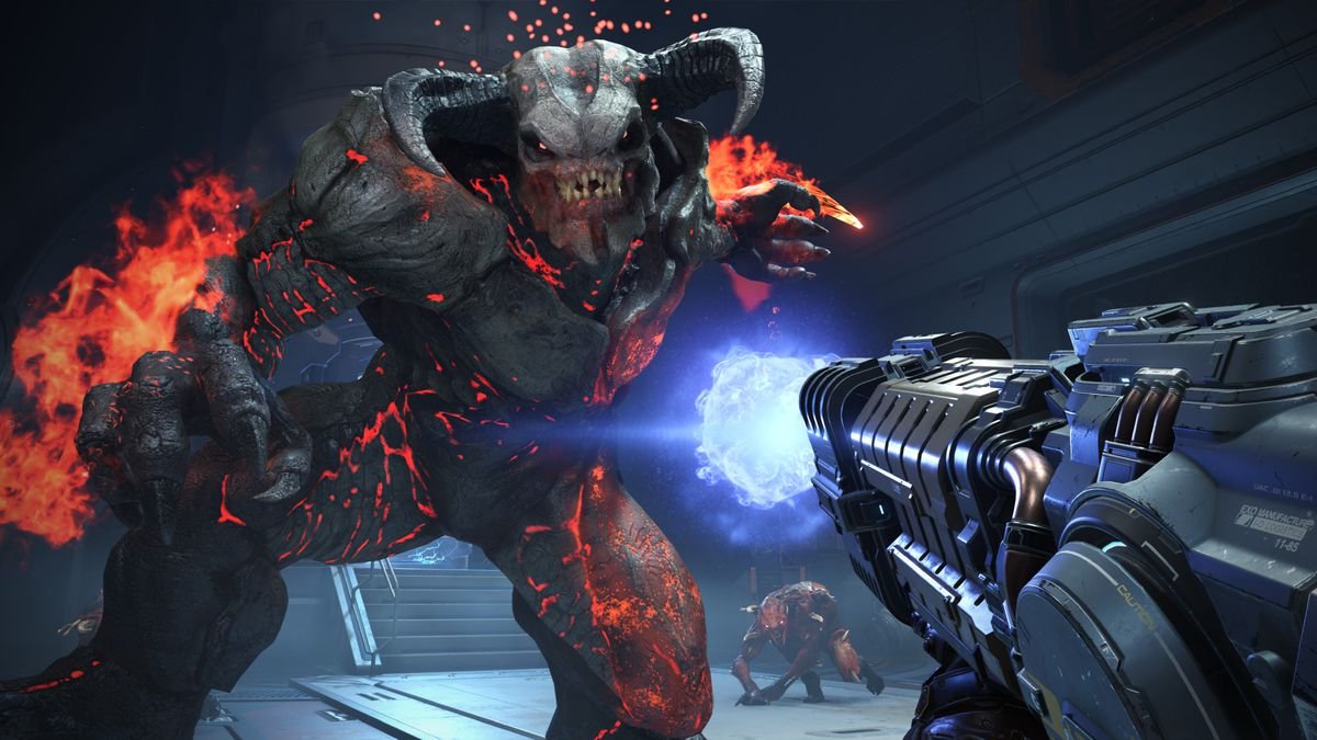 a huge, horned demon covered in flames leers over the player in Doom Eternal