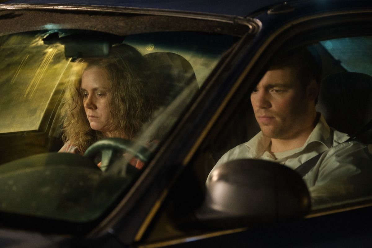 Amy Adams and Gabriel Basso sit sullenly in a car together in Hillbilly Elegy