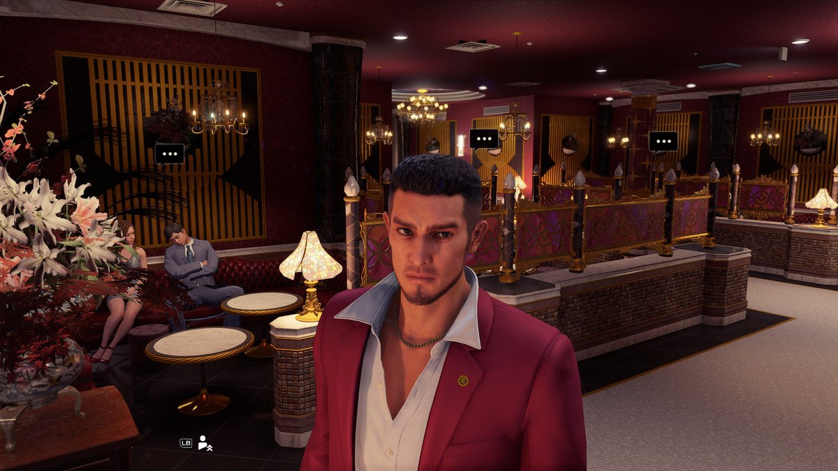 Yakuza: Like a Dragon protagonist Ichiban standing inside of a maid café