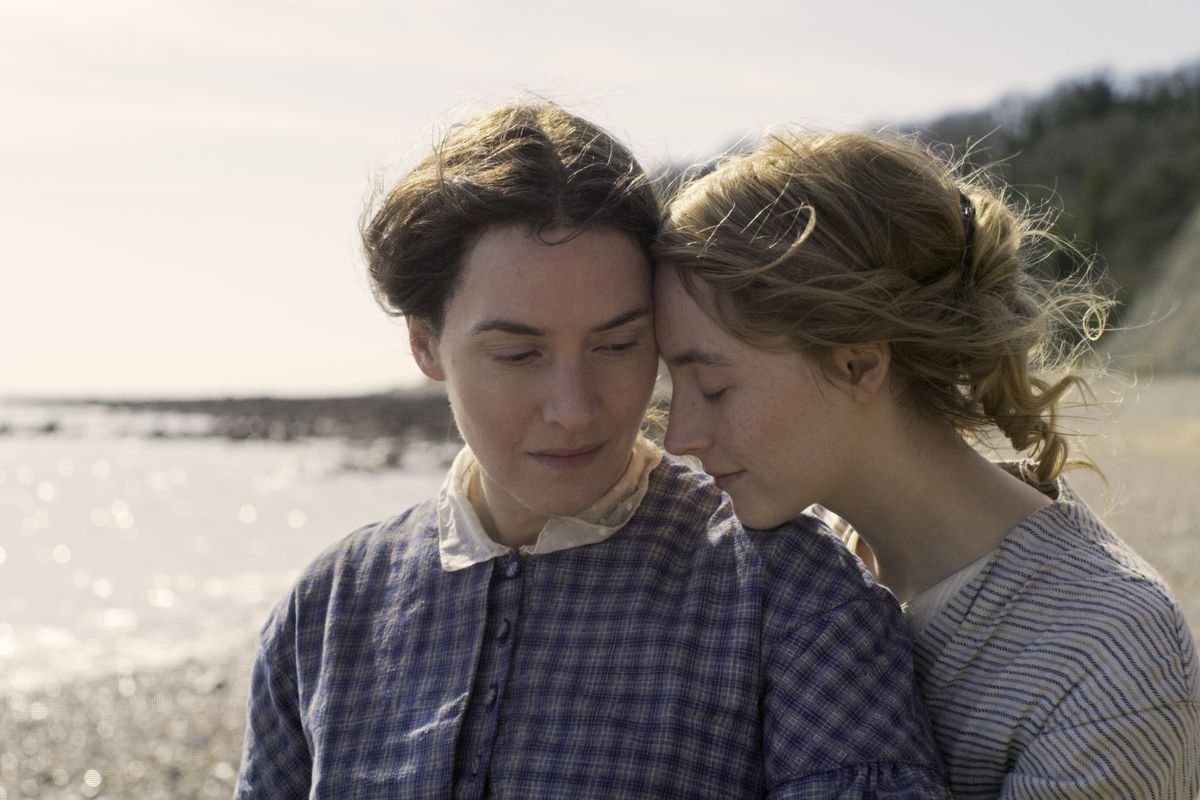 Saoirse Ronan nuzzles Kate Winslet on the beach in Ammonite