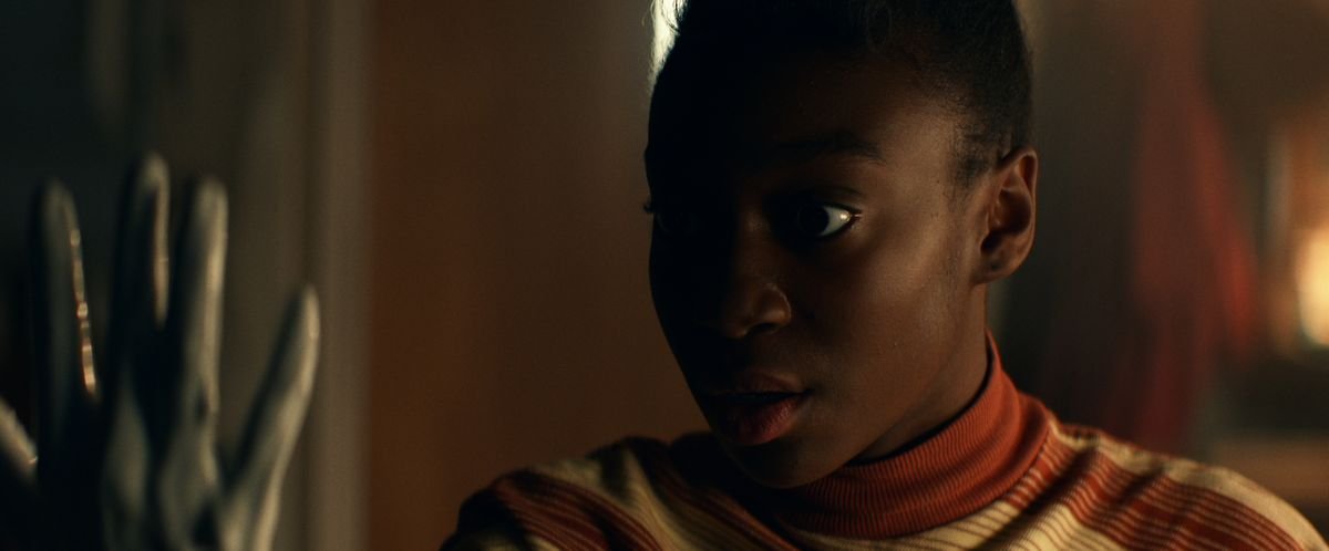 Shahadi Wright Joseph looks with shock at a withered grey hand in Amazon Studios’ Them