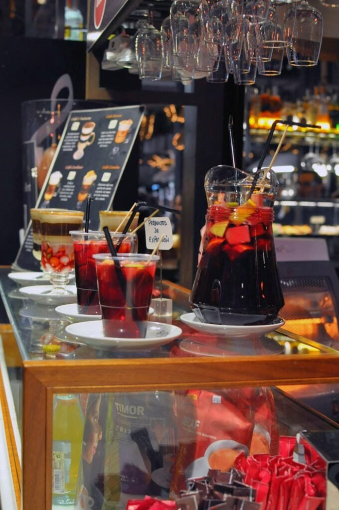 A Jar and several glasses of Sangria in one of Madrid's many food markets