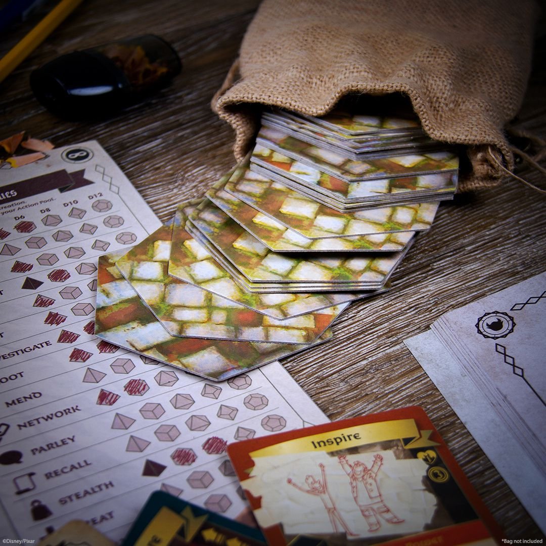 A pile of cobblestone tiles falls out of a jute bag onto a character sheet