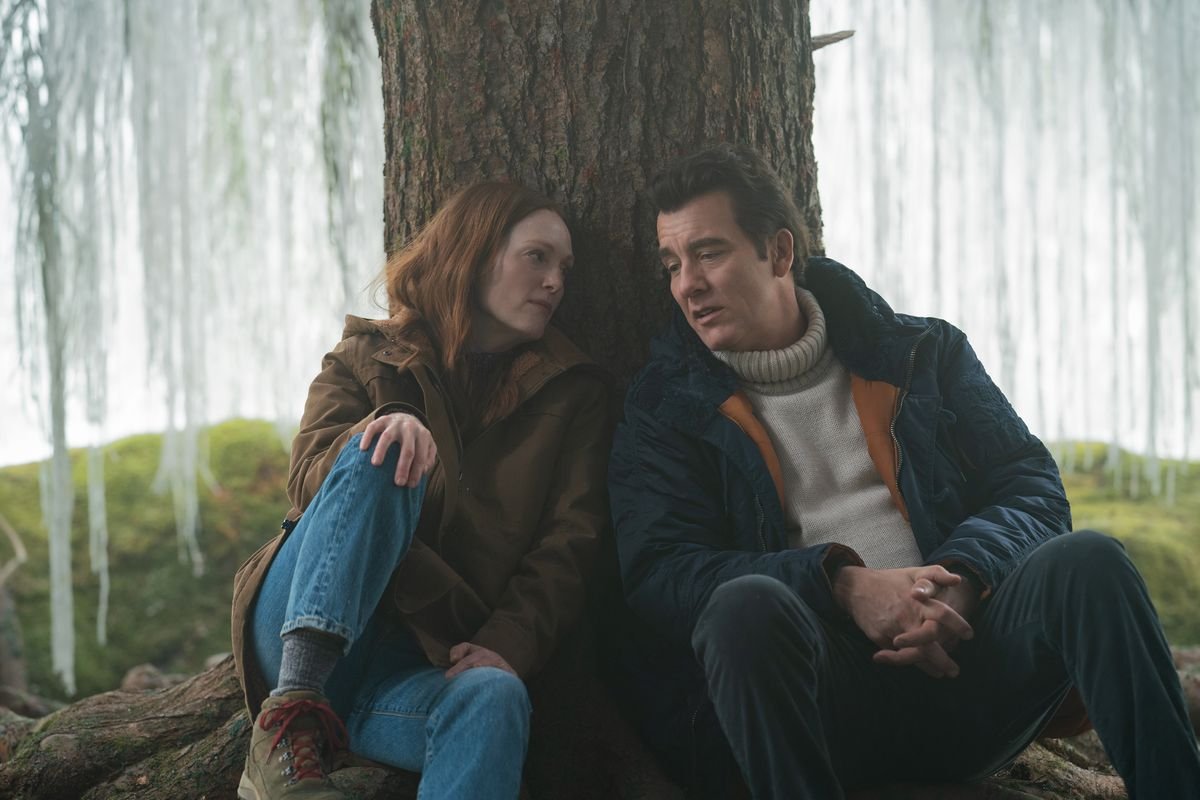 Julianne Moore and Clive Owen sit with their heads together under a magical silver willow tree in Lisey’s Story