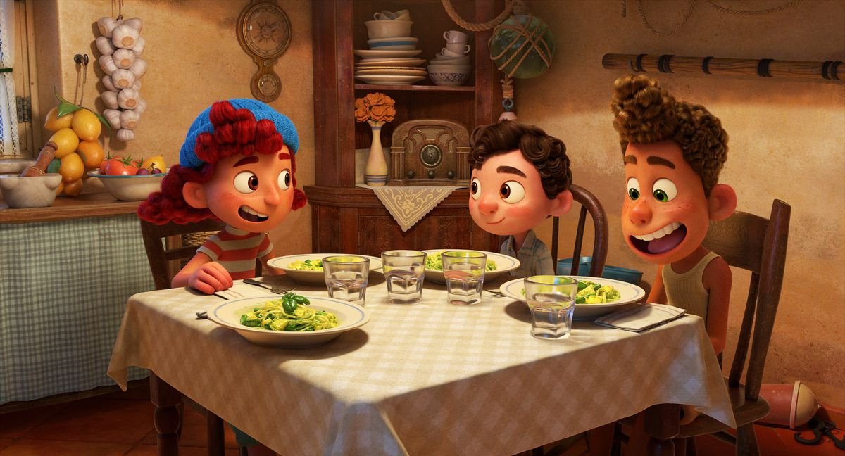 giulia, luca, and alberto eating pasta