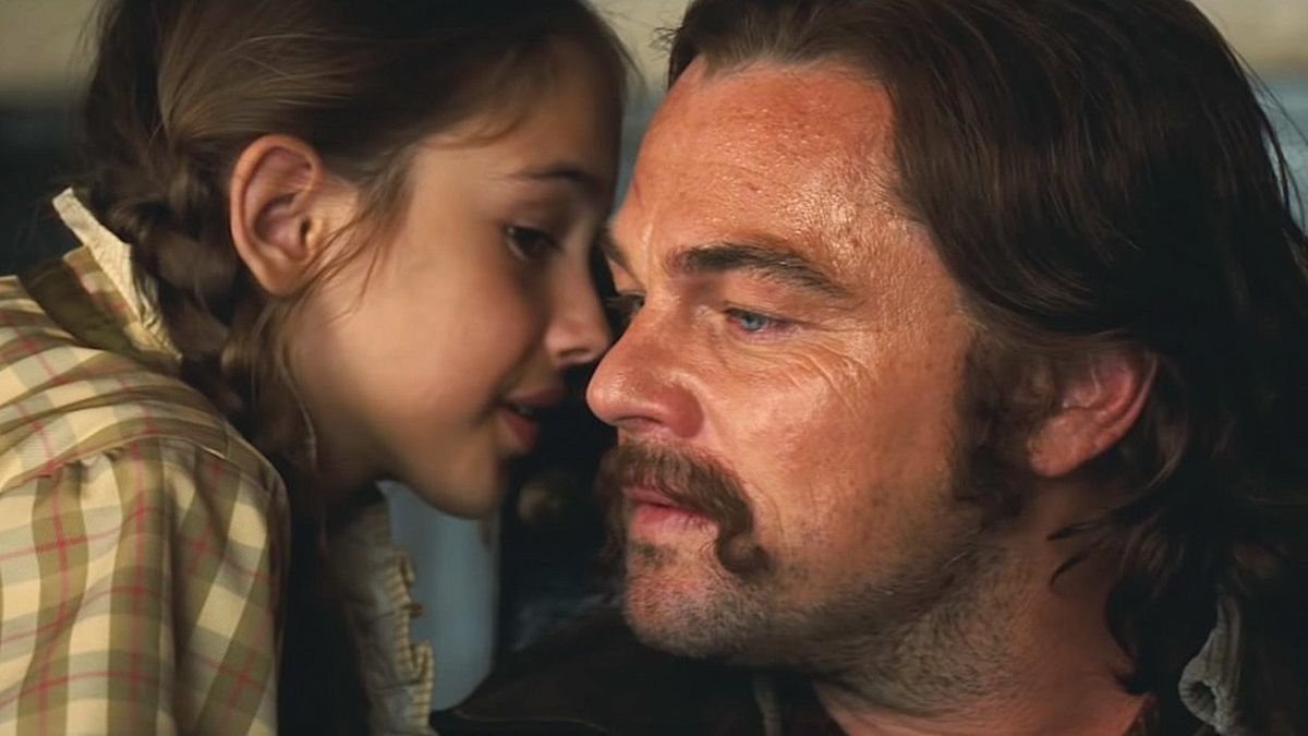 Trudi (Julia Butters) whispers in Rick’s (Leonardo DiCaprio) ear after a successful shot in Quentin Tarantino’s Once Upon a Time in Hollywood