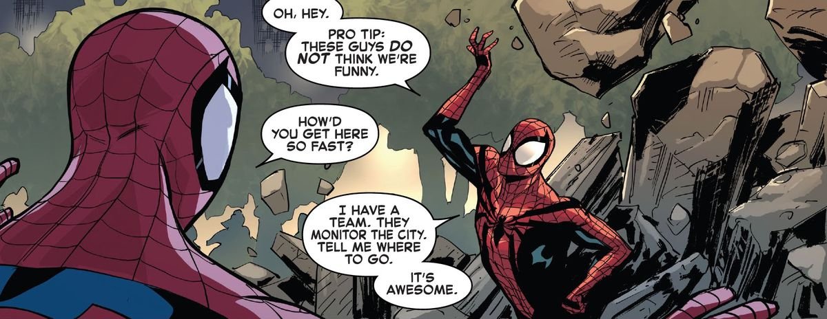 “How’d you get here so fast?” asks Peter Parker Spider-Man of  Ben Reilly Spider-Man. “I have a team,” he replies, while shrugging off some heavy debris. “They monitor the city. Tell me where to go. It’s awesome.” In The Amazing Spider-Man #75 (2021). 