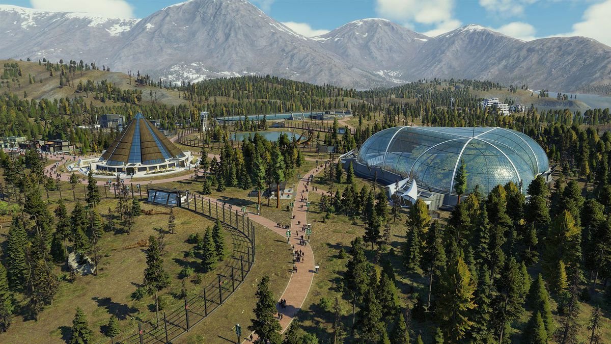 A pen, aviary exhibit, and lagoon exhibit in Jurassic World Evolution 2