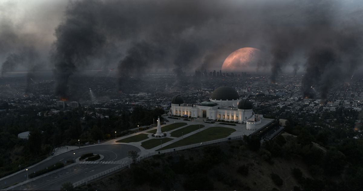 An extremely close Moon looms large over Los Angeles from behind the Griffith Observatory.