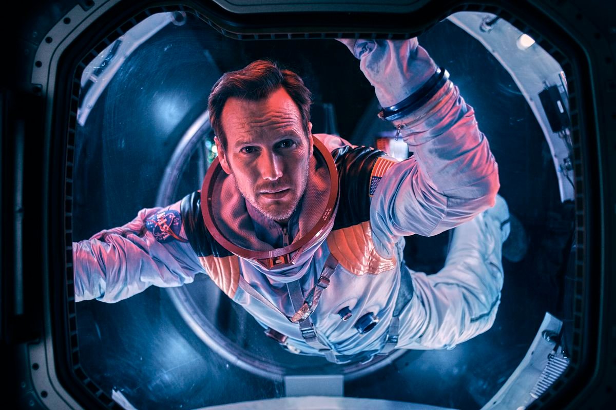 Patrick Wilson in a spacesuit floats in an airlock in Moonfall