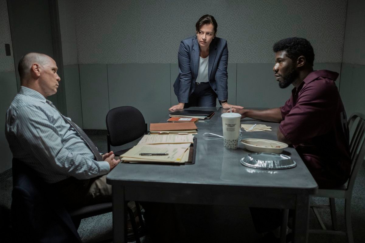 Cops talking to a perp in an interrogation room