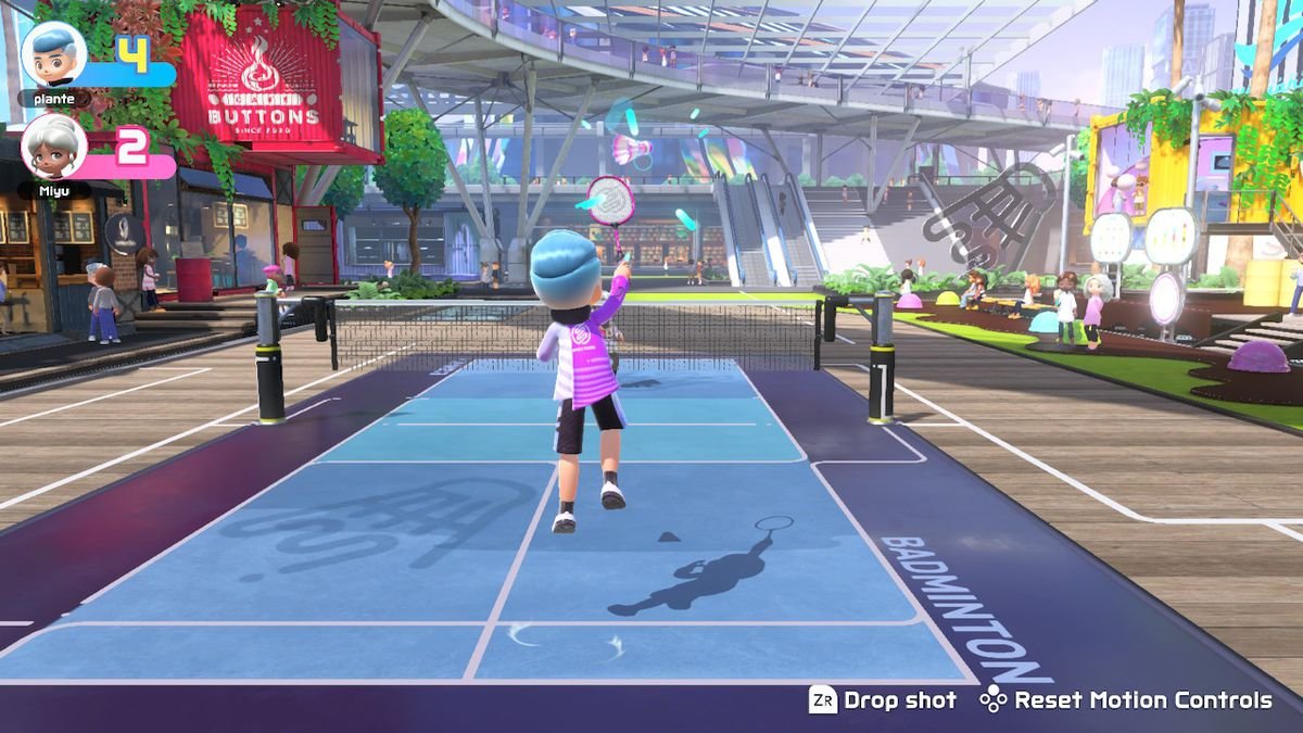 A player leaps to hit the shuttlecock in badminton in Nintendo Switch Sports