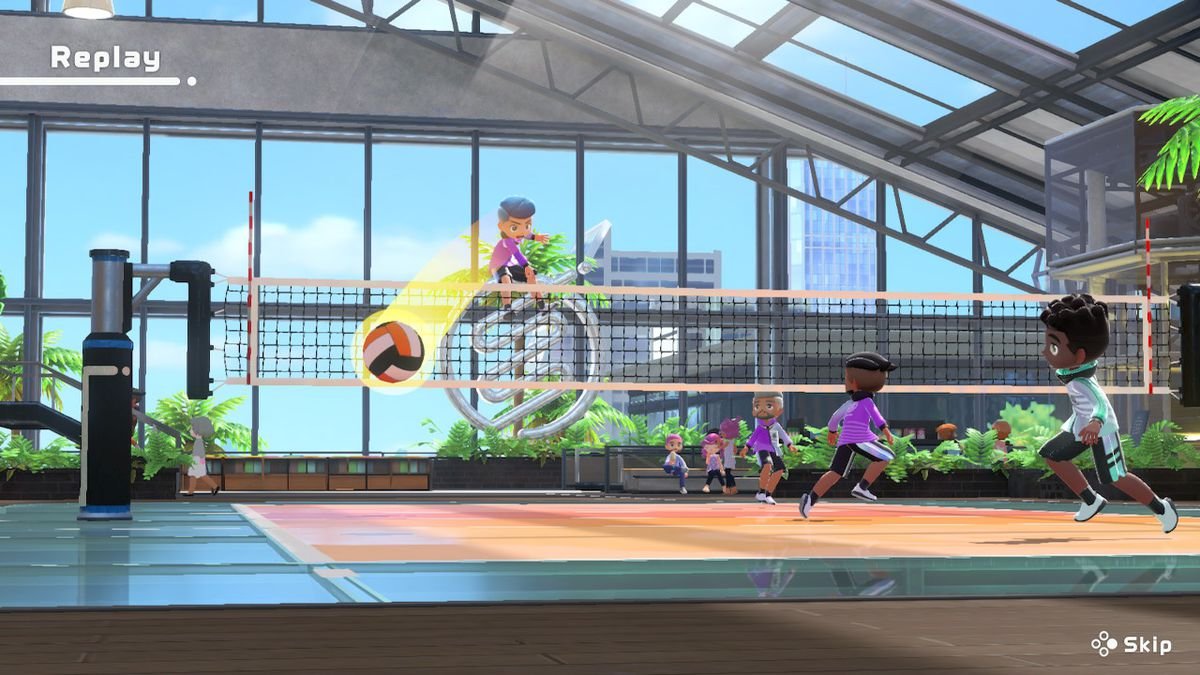 A player spikes a volleyball into the back corner of the court in Nintendo Switch Sports