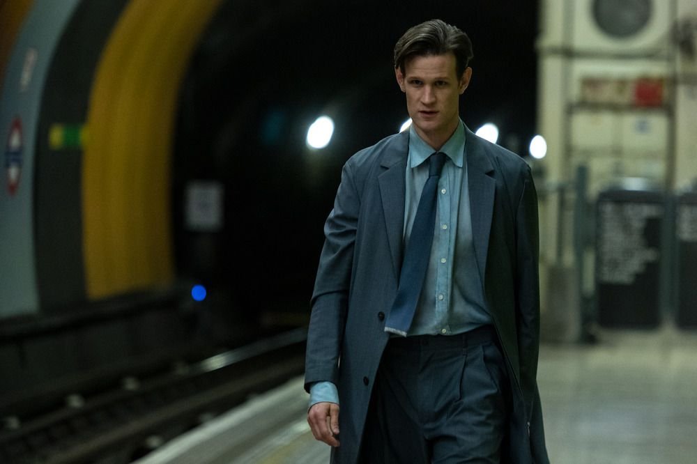 Matt Smith walking through a subway station as Milo in the film Morbius