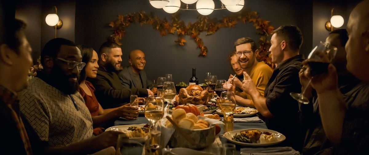 Bobby (Billy Eichner) commands the Thanksgiving dinner table with Peter (Peter Kim), Paul (Justin Covington), Tina (Monica Raymund), Edgar (Guillermo Díaz), Tom (D’Lo), Lucas (Becca Blackwell), Aaron (Luke Macfarlane), Marty (Symone) and Henry (Guy Branum) all seated around him