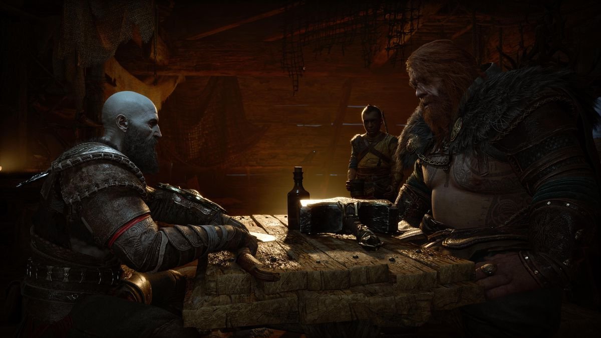 Kratos and Thor speak at the table with Atreus hovering in the background in God of War Ragnarök