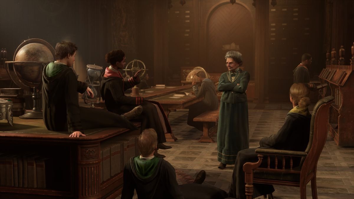 A group of students lounges around a classroom with various tools and teaching materials, and a middle-aged woman as the professor in the center, in Hogwarts Legacy