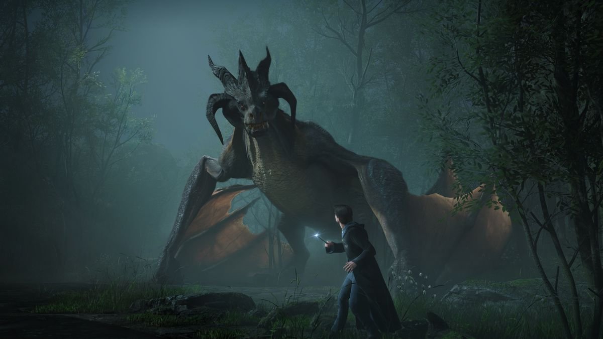 A dragon looms over a wizard in the forest at night in Hogwarts Legacy