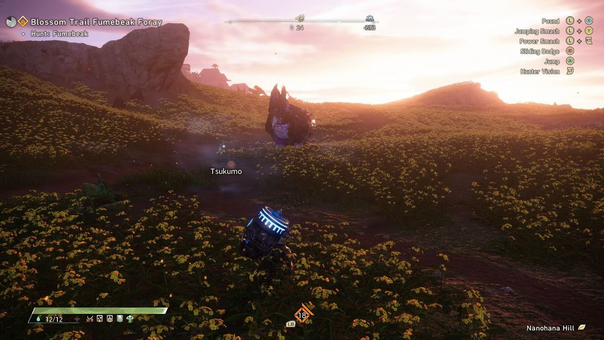 The player character crouches in a poppy field at dusk while hunting a monster in  Wild Hearts