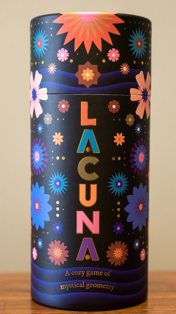 The Lacuna tube/box. The subtitle is “A cozy game of mystical geometry.”