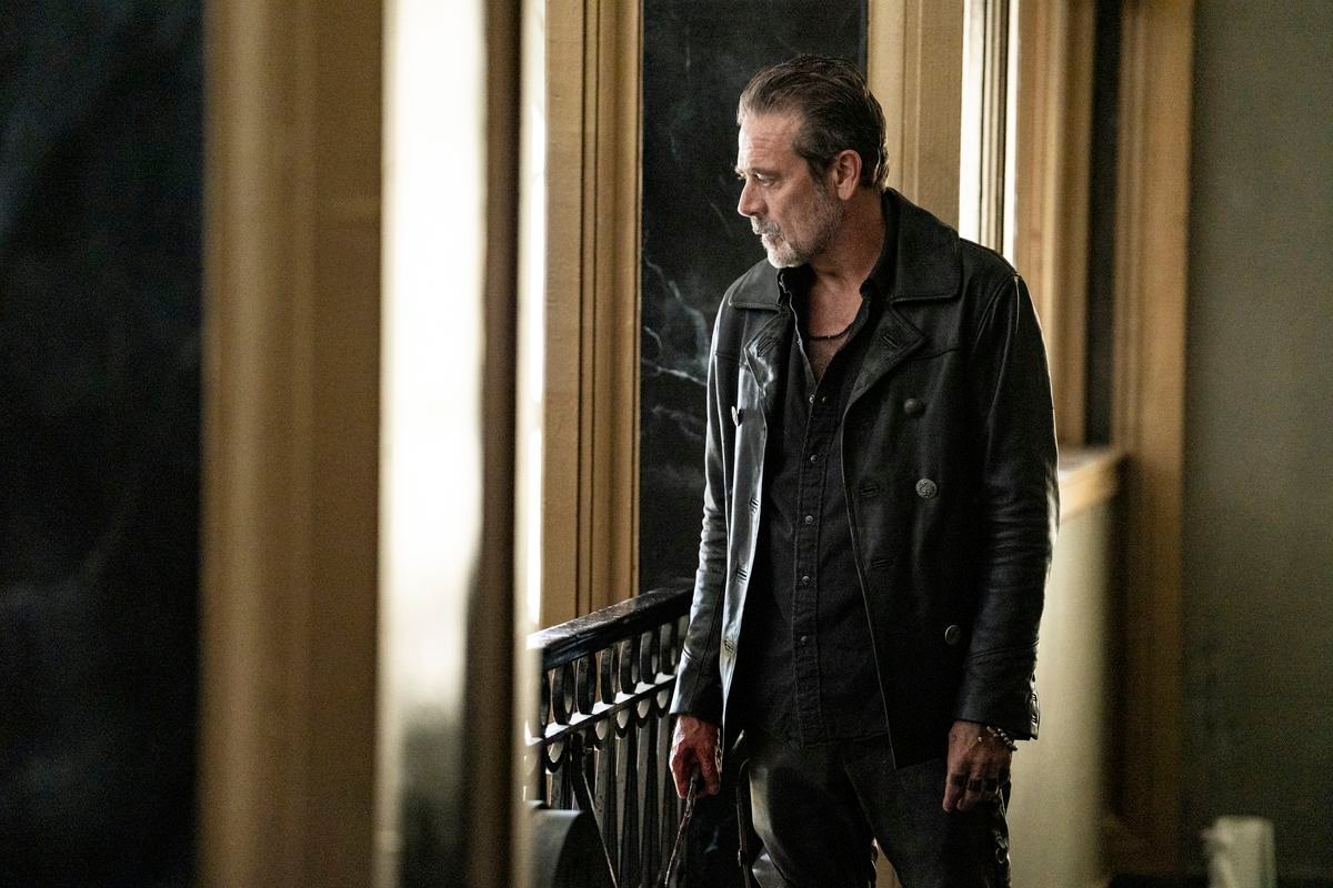 Negan (Jeffrey Dean Morgan) looking wearily out a window in a still from Dead City