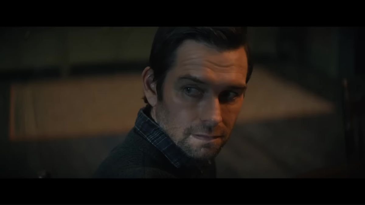 Antony Starr looks over his shoulder as the light from an open door casts across his face in the movie Cobweb