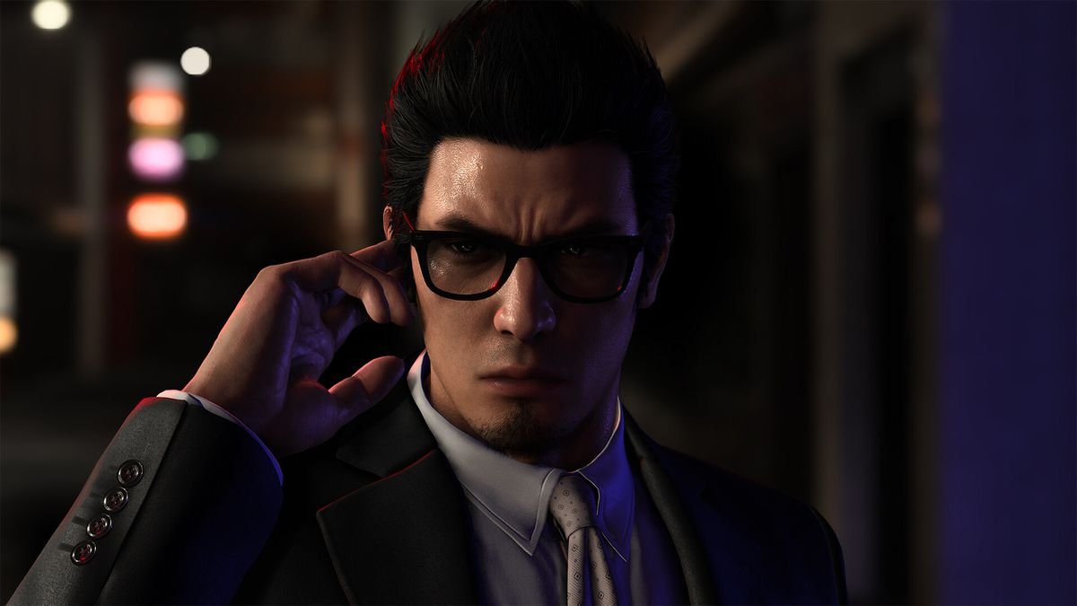 A yakuza wearing sunglasses holds his finger to hear something in an earpiece in Like a Dragon Gaiden: The Man Who Erased His Name