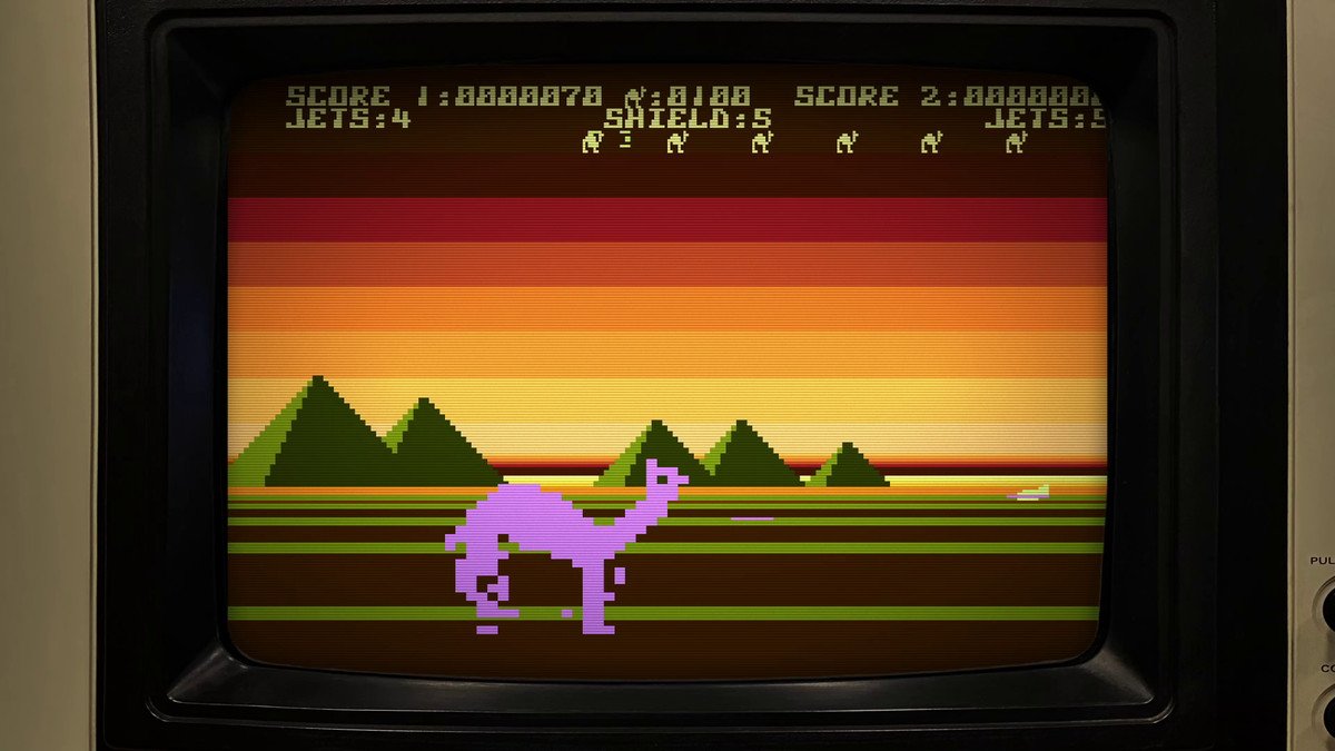 A giant pink camel marches in front of a stark view of pyramids at sunset in Attack of the Mutant Camels