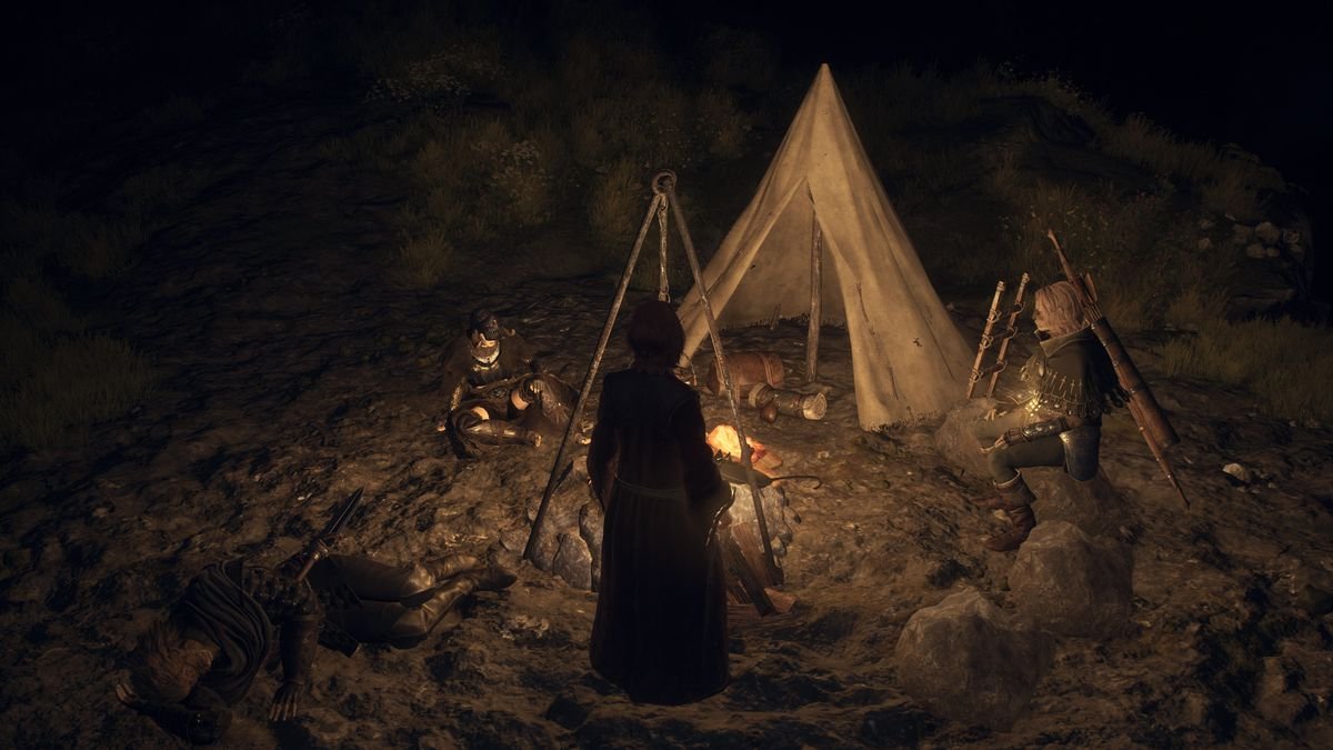 An Arisen and Pawns settle in around a campfire and tent at nighttime in a screenshot from Dragon’s Dogma 2
