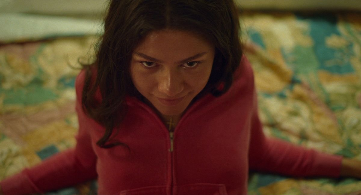 Teenage tennis champion Tashi (Zendaya) leans back on a hotel bed and gives the camera a come-hither smile in Challengers